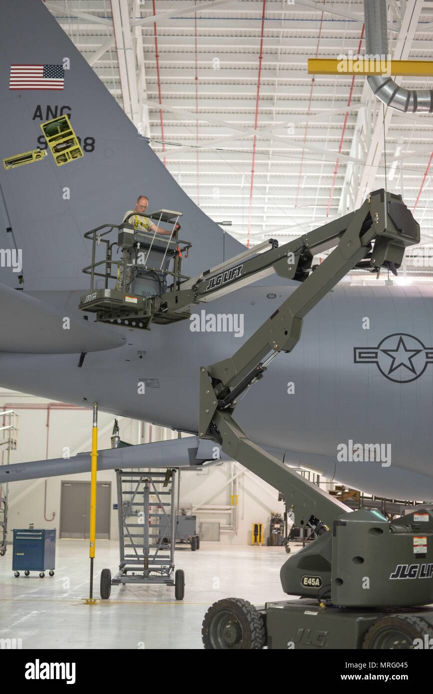U.S. Air Force Technical Sgt. Scott Aton with the 101st Air Refueling Wing, Maine Air National Guard operates a JLG Articulating Boom Lift at the 101st Air Refueling Wing, Bangor, ME, Jun 13, 2017.  Aton participated in the acceptance inspection of a 101st Air Refueling Wing KC-135 Stratotanker post Depot Level Maintenance.  (U.S. Air National Guard photo by Staff Sgt. Travis Hill) Stock Photo