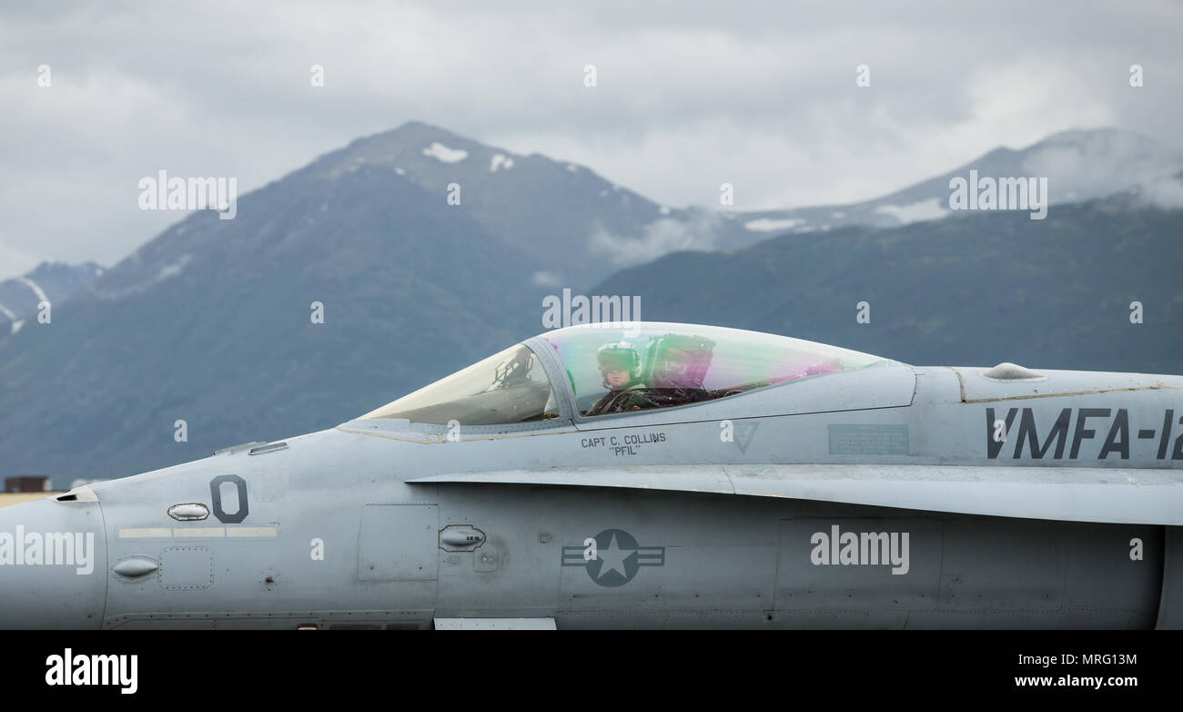 An F/A-18C Hornet assigned to Marine Fighter Attack Squadron 251 on the flight line during Red Flag-Alaska 17-2 on Joint Base Elmendorf–Richardson, Alaska, June 12, 2017. Red Flag-Alaska provides an optimal training environment in the Indo-Asian Pacific region and focuses on improving ground, space, and cyberspace combat readiness and interoperability for U.S. and international forces. (U.S. Marine Corps photo by Lance Cpl. Koby I. Saunders) Stock Photo