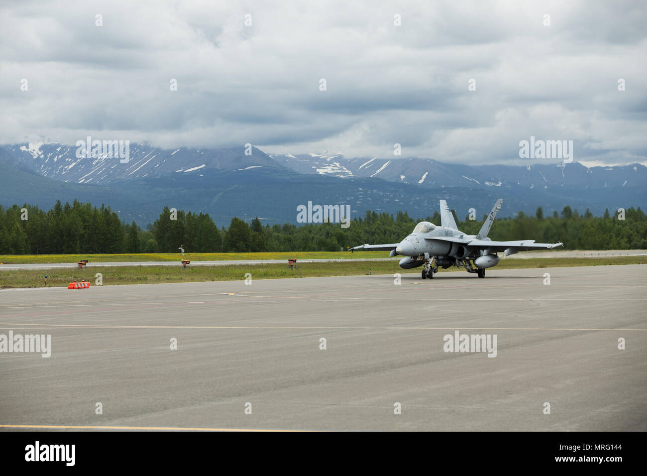 An F/A-18C Hornet assigned to Marine Fighter Attack Squadron 251 taxis on a flight line during Red Flag-Alaska 17-2 on Joint Base Elmendorf–Richardson, Alaska, June 12, 2017. Red Flag-Alaska provides an optimal training environment in the Indo-Asian Pacific region and focuses on improving ground, space, and cyberspace combat readiness and interoperability for U.S. and international forces. (U.S. Marine Corps photo by Lance Cpl. Koby I. Saunders) Stock Photo