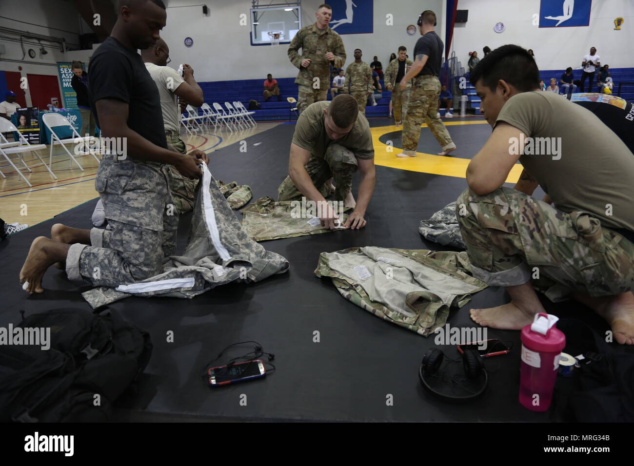 2nd Quarterly Combatives Tournament fighters tape the zippers on their