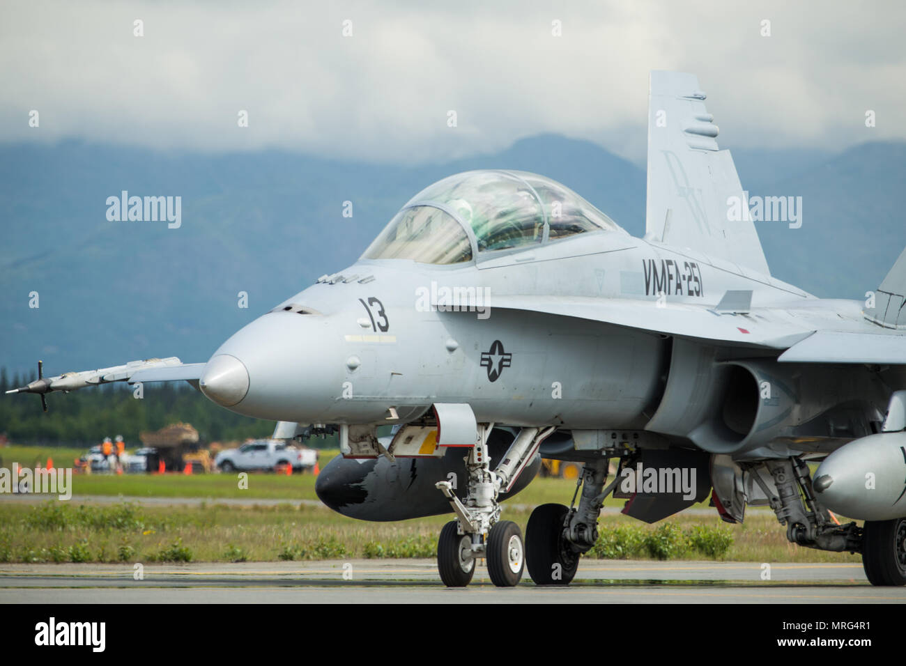 A U.S. Marine Corps F/A-18C Hornet with Marine Fighter Attack Squadron 251 taxis down a flightline during a joint training exercise Red Flag-Alaska 17-2 on Joint Base Elmendorf-Richardson, Alaska, June 13, 2017. Red Flag-Alaska provides an optimal training environment in the Indo-Asian Pacific region and focuses on improving ground, space, and cyberspace combat readiness and interoperability for U.S. and international forces. (U.S. Marine Corps photo by Lance Cpl. Koby I. Saunders) Stock Photo