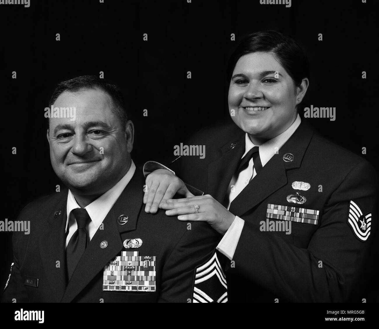 McGHEE TYSON AIR NATIONAL GUARD BASE -Retired Chief Master Sgt. Bart Welch  and daughter Tech. Sgt. Jordan Welch, a services apprentice with the 134th  Air Refueling Wing, pose for a photo to
