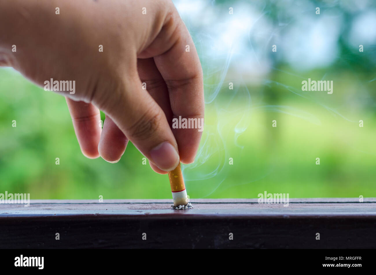 World No Tobacco Day Men cigarette break And send a cigarette Stock Photo