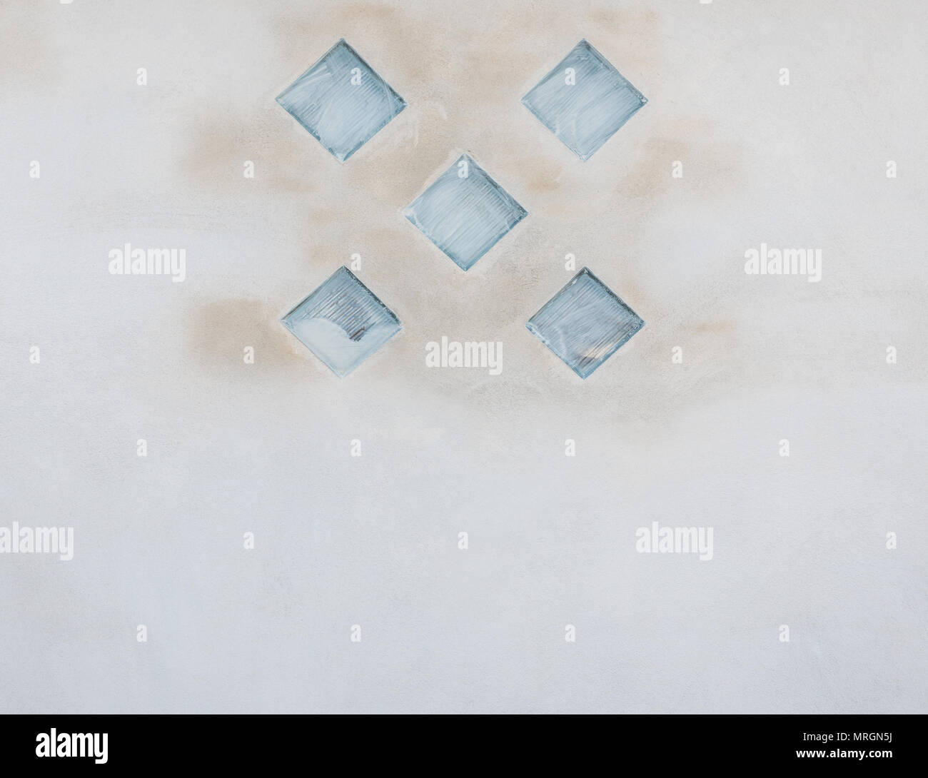 Glass block pattern on the concrete wall of the constrcution house