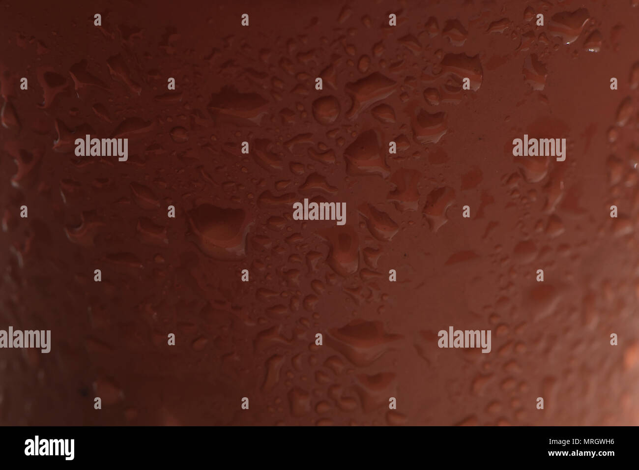 water droplets on a plastic brown surface Stock Photo