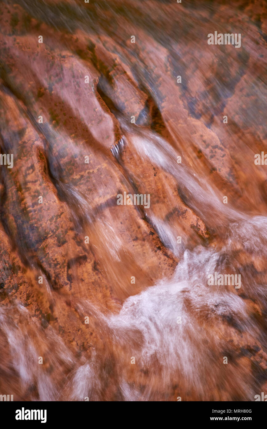 Close up of water flowing across the red rocks at Douglas Falls near Thomas West Virginia Stock Photo