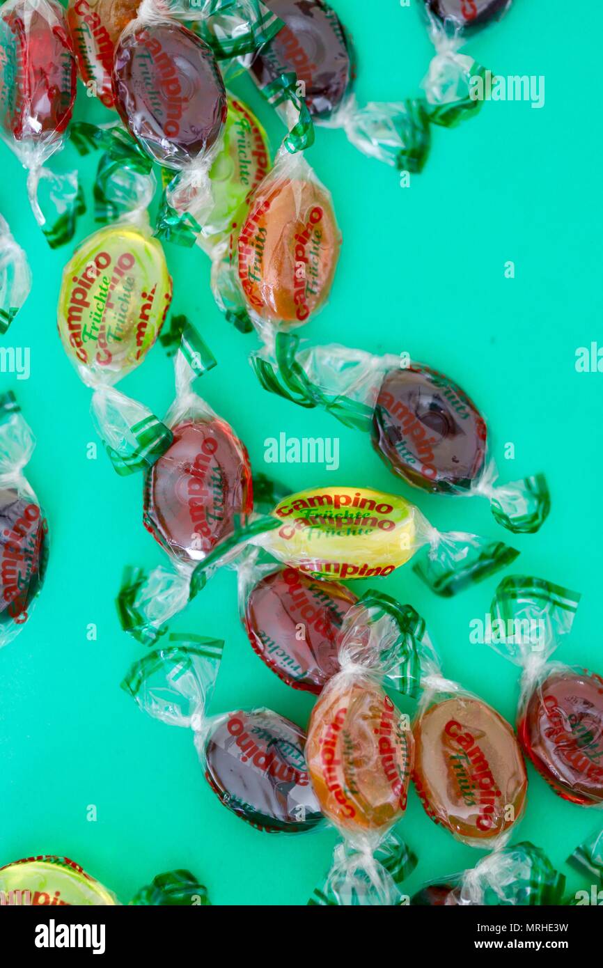 Campino boiled fruit flavoured sweets on a turquoise background. Stock Photo