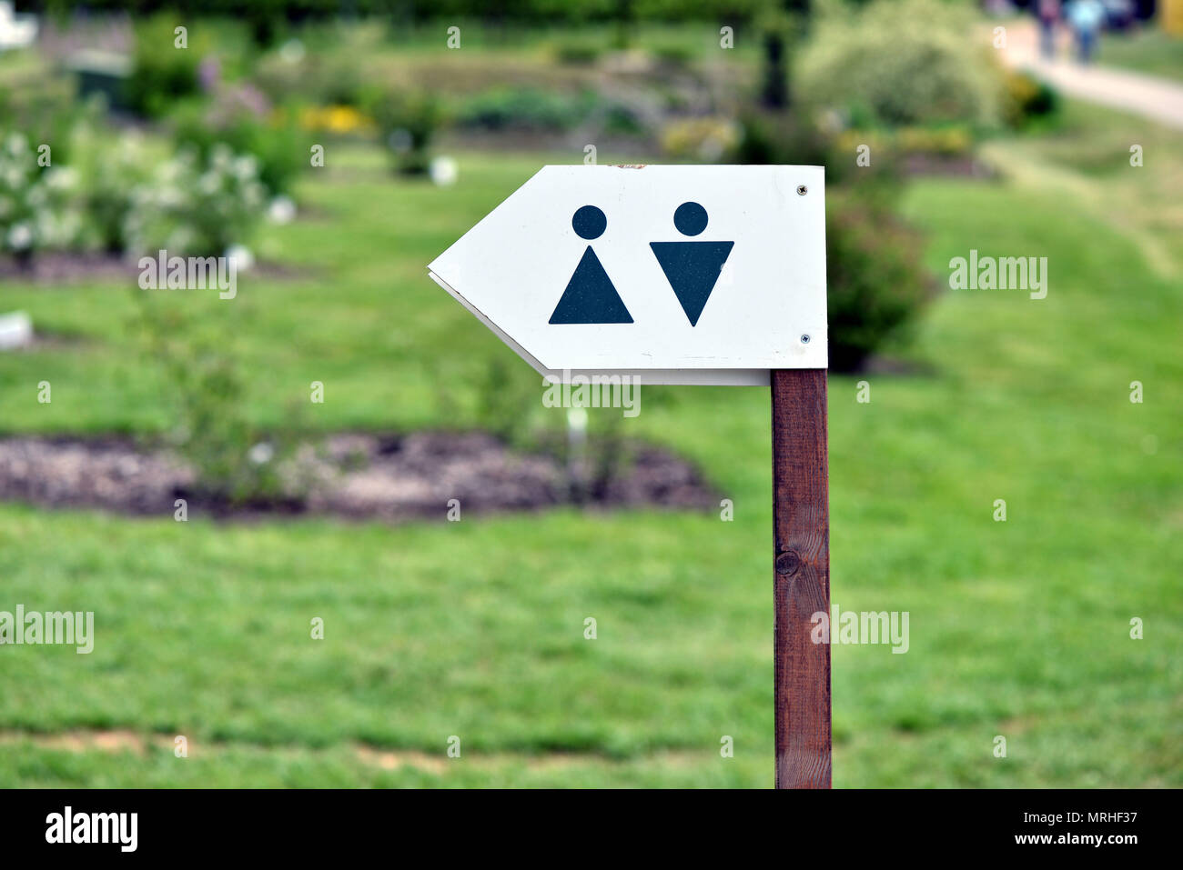 Toilet direction board in the garden Stock Photo Alamy