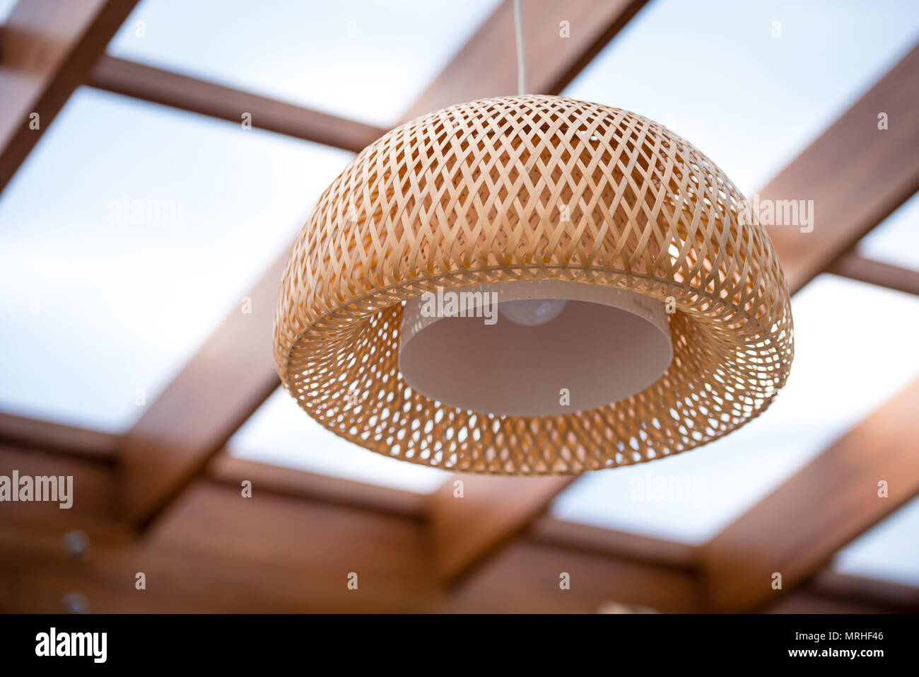 Interior Of The Outdoor Terrace With A Wicker Wood Ceiling Lamp