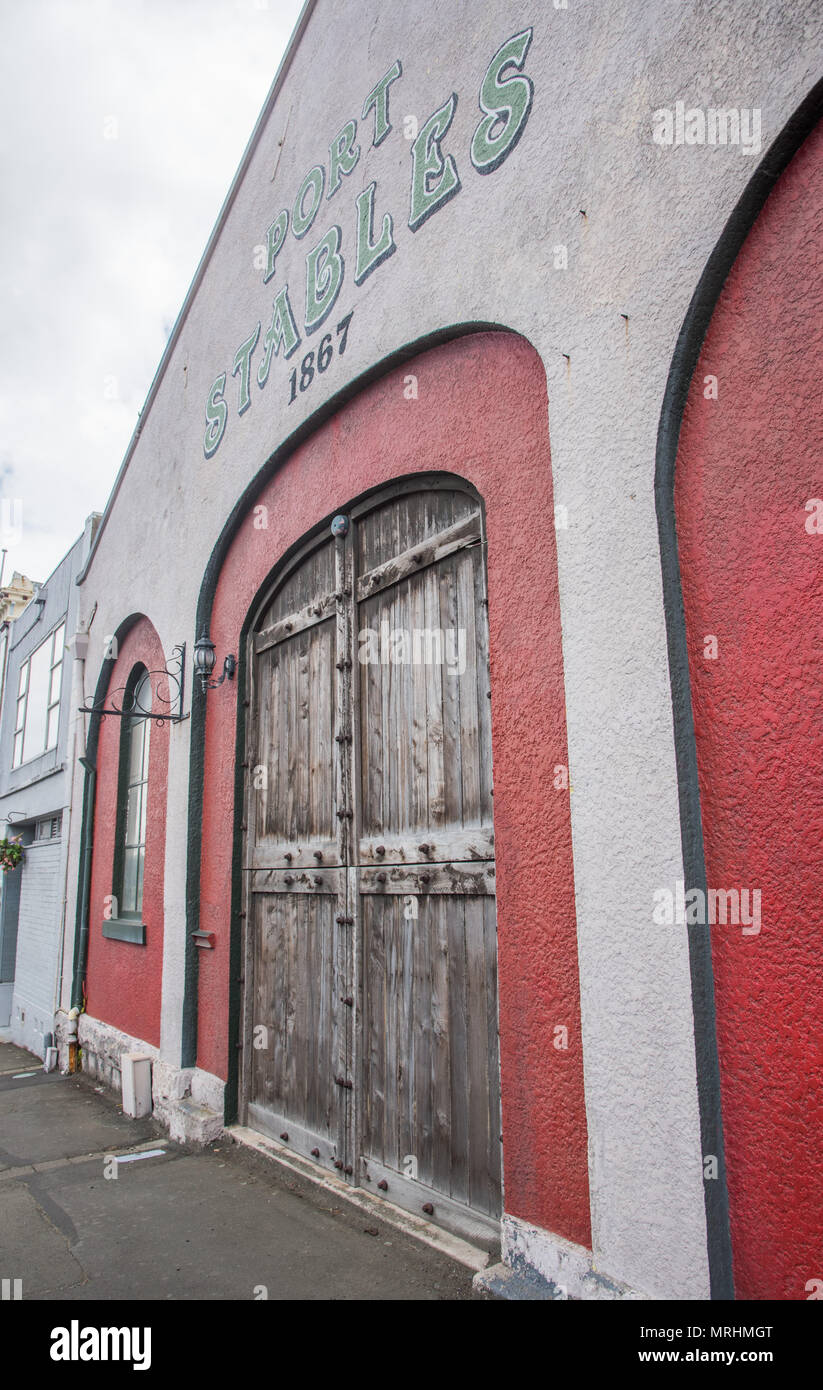 Port Chalmers, Dunedin, New Zealand-December 11,2016: Arched facade of the Port Stables business in downtown Port Chalmers in Dunedin, New Zealand Stock Photo