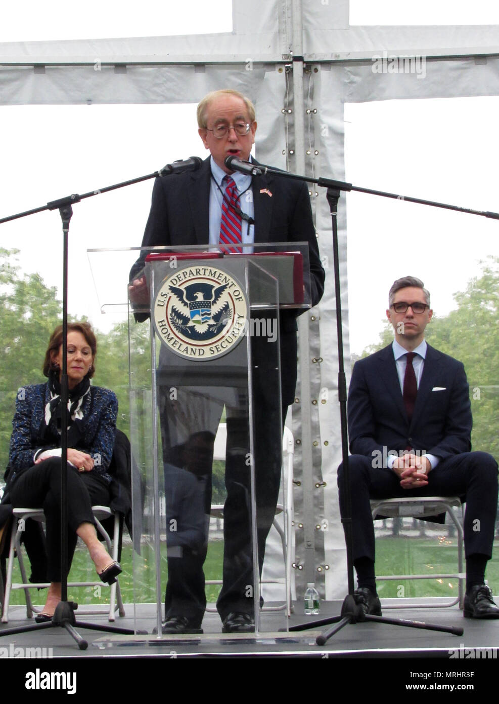 John E. Thompson (center), acting district director of U.S. Citizenship and Immigration Services