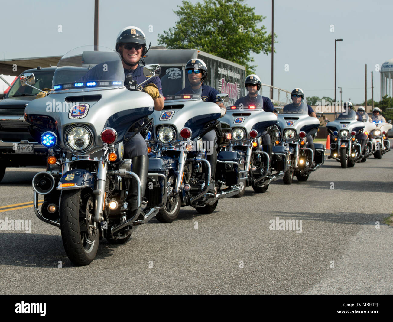 Prince George’s County policemen ride in formation during the Seventh Annual Motorcycle Safety Day at Joint Base Andrews, Md., June 15, 2017. This year’s MSD was considerably larger compared to previous years and was supported by more than five law enforcement departments, including the Anne Arundel County Police, Virginia State Police and Prince George’s County Sheriff’s Department. (U.S. Air Force photo by Airman 1st Class Valentina Lopez) Stock Photo