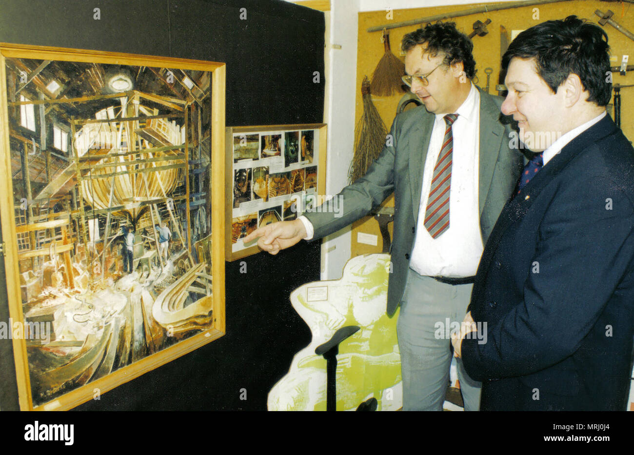 2006 - In the former (but then new) Archive & Heritage Centre premises at  Grape Lane, Whitby, Yorkshire. Colin Waters (Director) shows British  MP Lawrie Quinn some of the exhibits Stock Photo