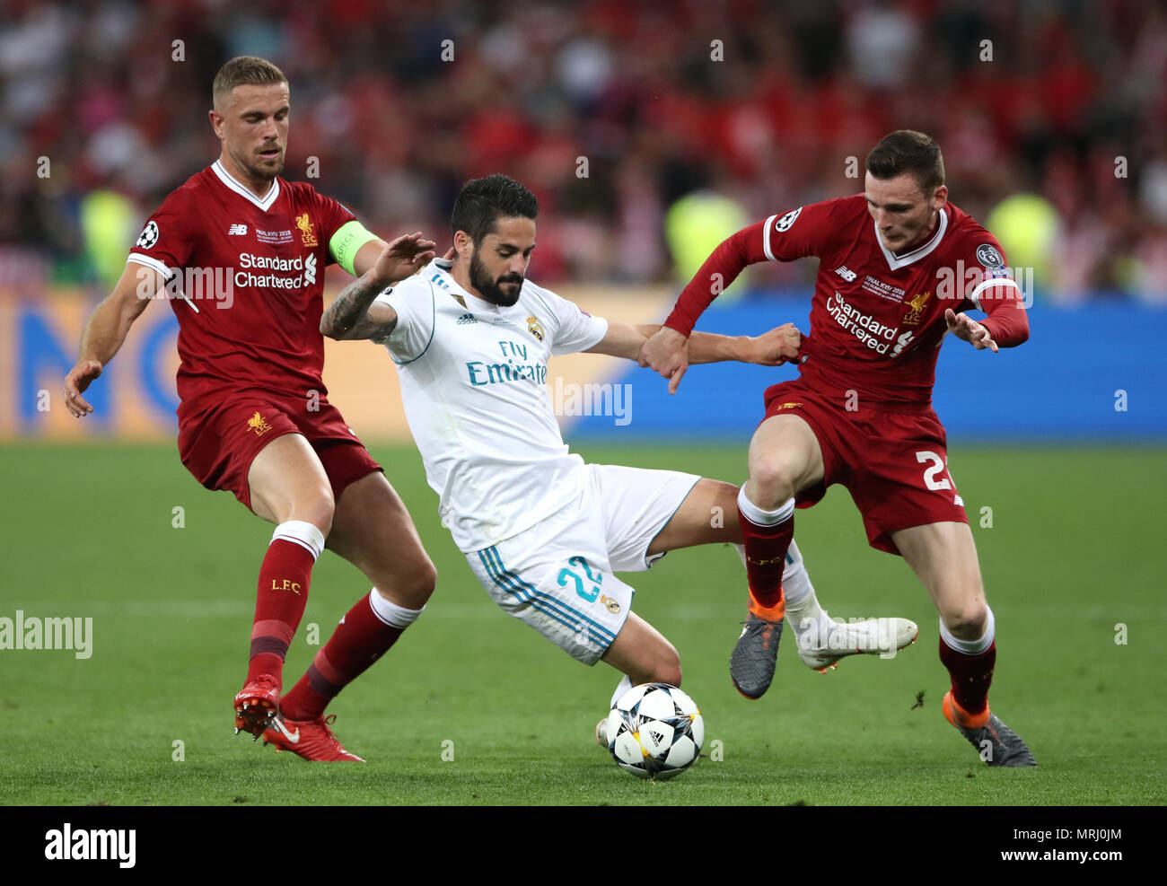 Liverpool's Jordan Henderson (left) and Andrew Robertson battle for the ball with Real Madrid's Alarcon Isco during the UEFA Champions League Final at the NSK Olimpiyskiy Stadium, Kiev. Stock Photo
