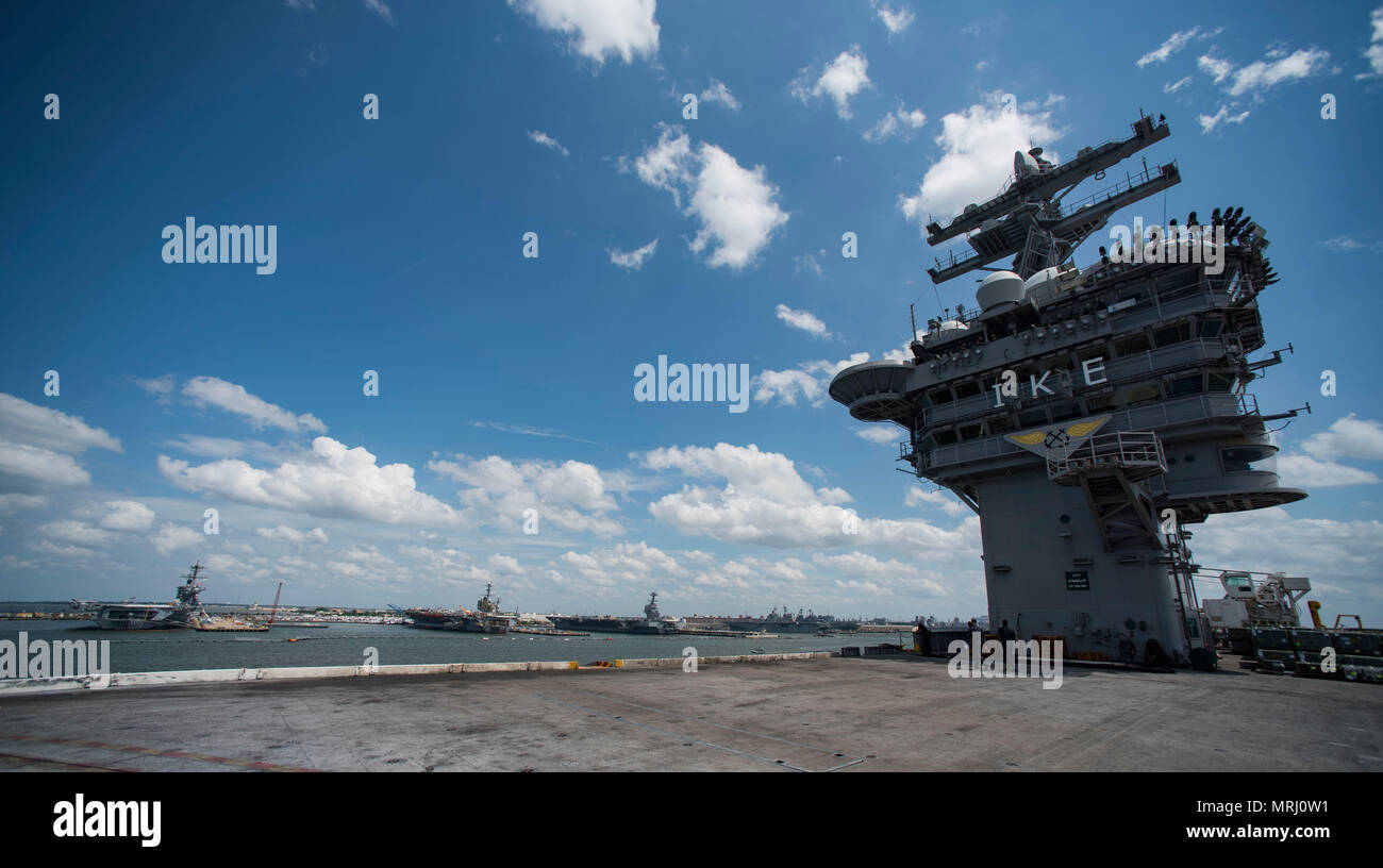 170619-N-QI061-087   ATLANTIC OCEAN (June 19, 2017) The aircraft carrier USS Dwight D. Eisenhower (CVN 69) (Ike) sails past the Nimtiz-class aircraft carriers USS Abraham Lincoln (CVN 72), USS George Washington (CVN 73) and the Ford-class aircraft carrier the future USS Gerald R. Ford (CVN 78) pier side at Naval Station Norfolk. Ike is underway during the sustainment phase of the Optimized Fleet Response Plan (OFRP). (U.S. Navy photo by Mass Communication Specialist 3rd Class Nathan T. Beard) Stock Photo