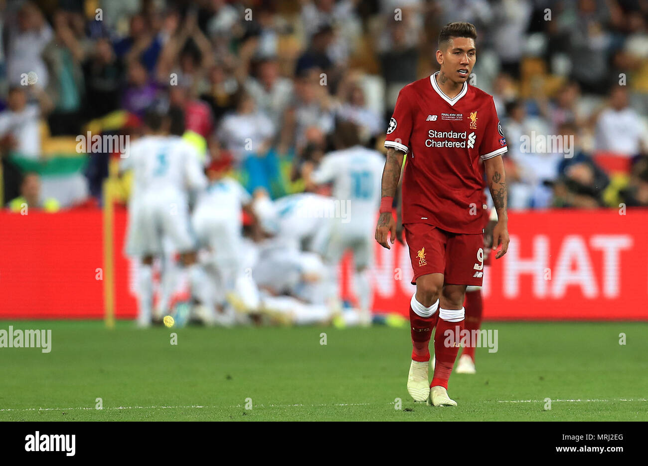 Liverpool's Roberto Firmino appears dejected after Real Madrid's Gareth Bale  (not pictured) scores his side's second goal of the game during the UEFA Champions  League Final at the NSK Olimpiyskiy Stadium, Kiev