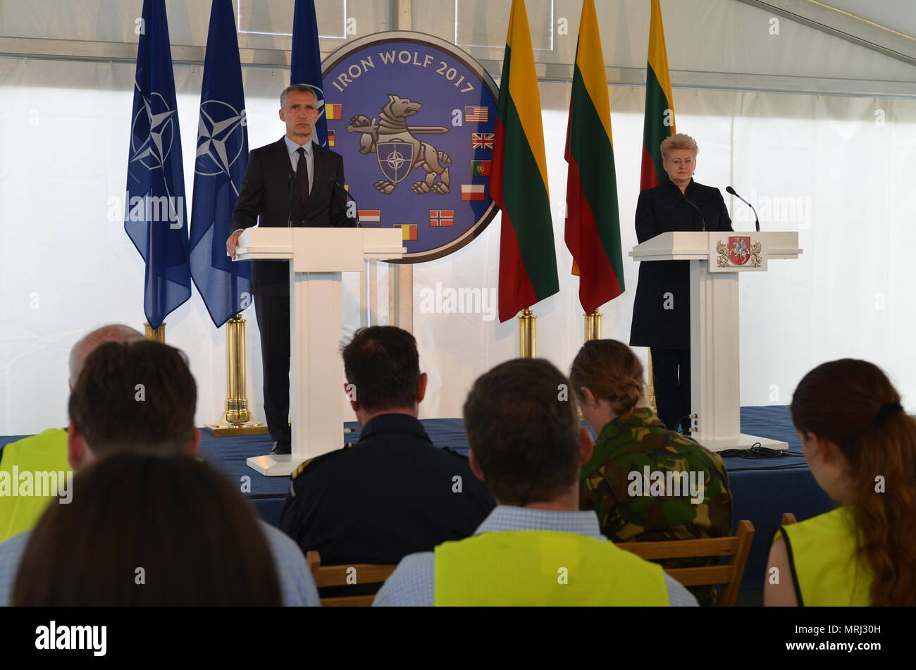 During a joint press conference with the Dalia Grybauskaite, President of the Republic of Lithuania, and Jens Stoltenberg, NATO Secretary General, the two leaders speak on the Suwalki Gap River Crossing and the development of NATO's Enhanced Forward Presence Battle Groups, June 20. The Battle Group conducts operations during Exercise Iron Wolf, a component of Saber Strike 17, to test their ability to mobilize quickly across the river, overcoming terrain. (U.S. Army photo by Sgt. Shiloh Capers) Stock Photo