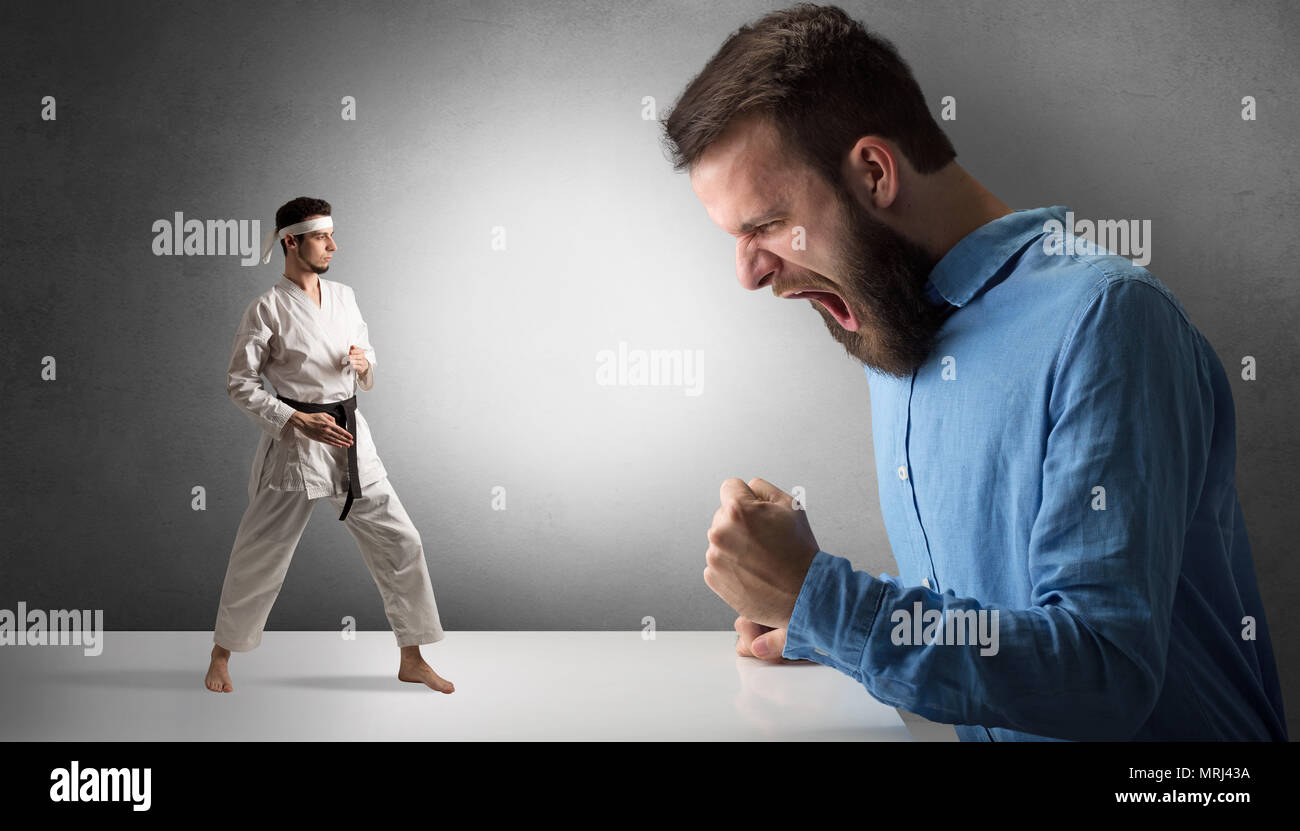 Giant hipster man yelling at a small karate man Stock Photo Alamy