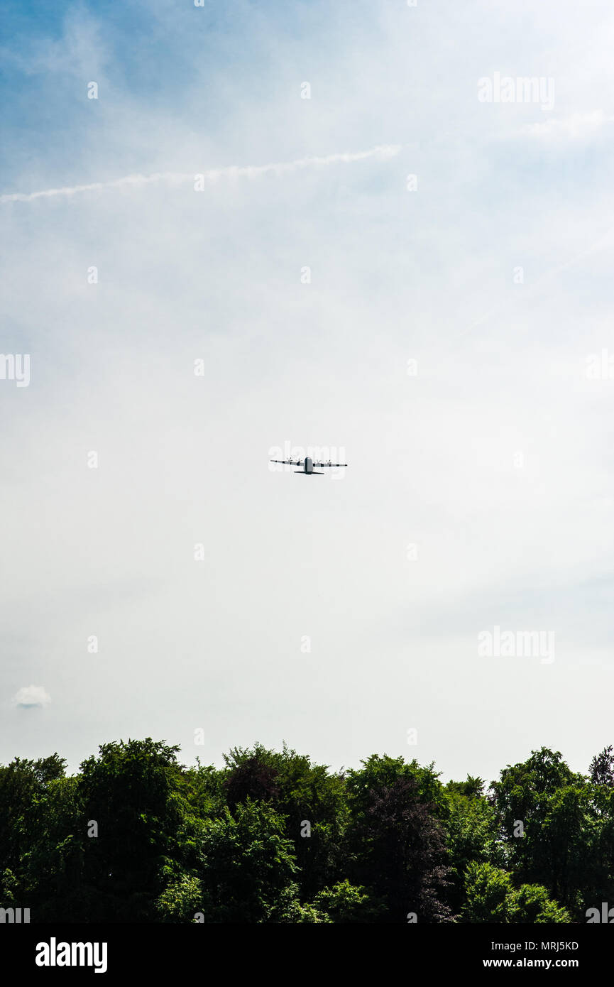 Symbolic American war plane flying above the cemeteries during the memorial day ceremony Stock Photo
