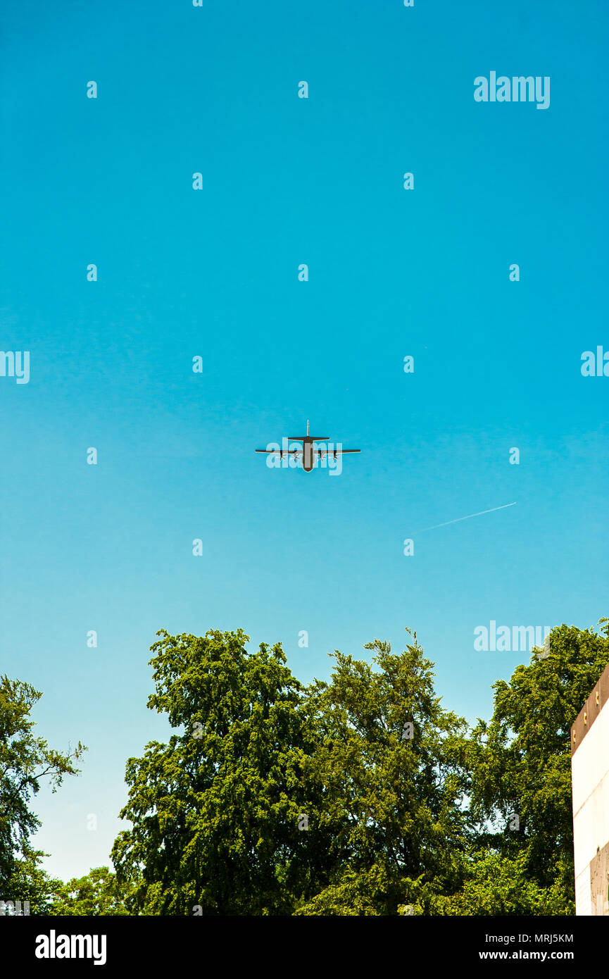 Symbolic American war plane flying above the cemeteries during the memorial day ceremony Stock Photo