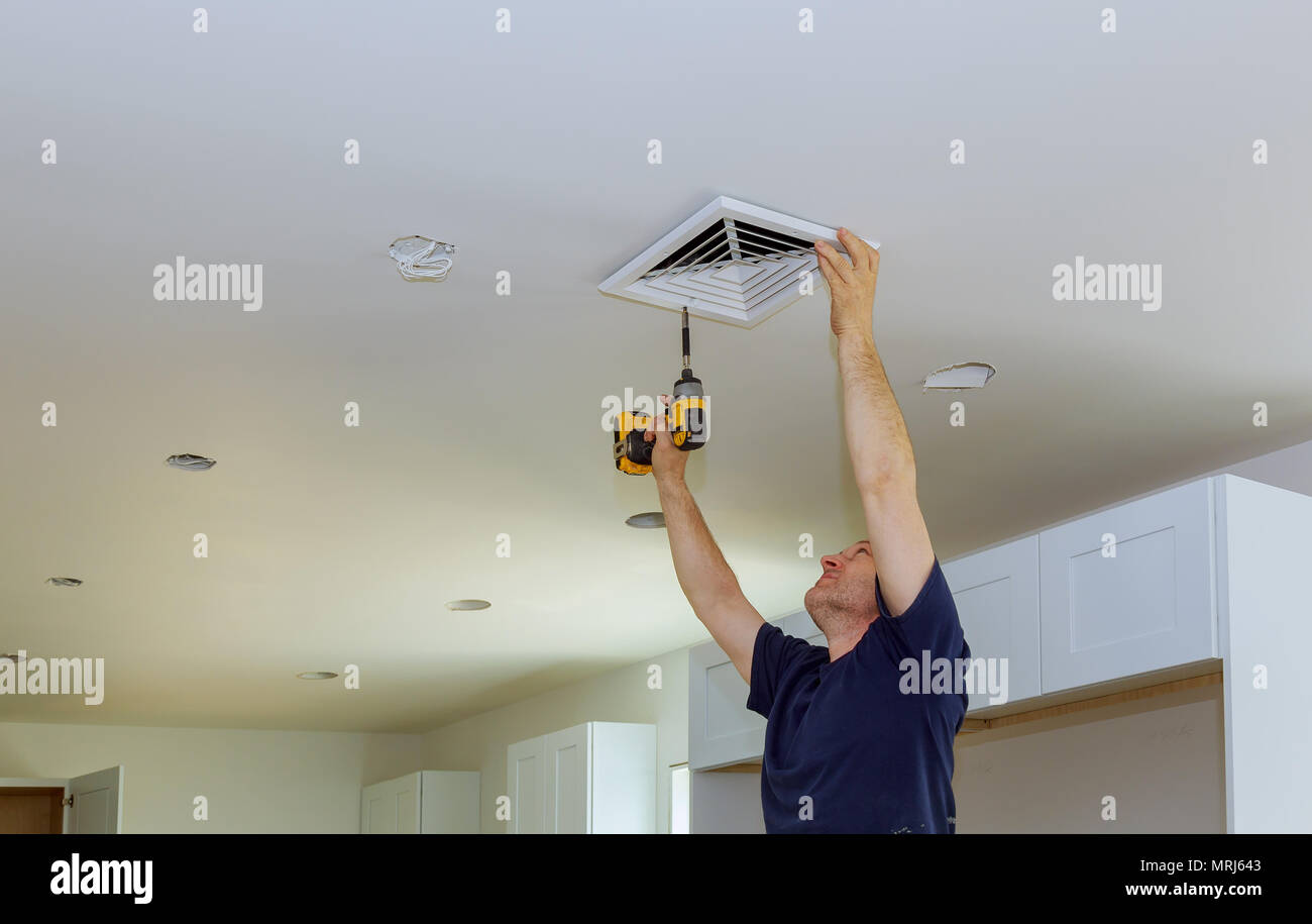 Indoor installing central air conditioning, vents on the wall Stock Photo