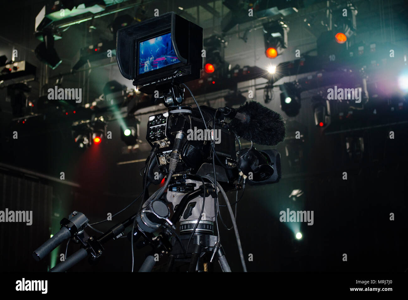 Professional video camera film concert on stage.Big pro 4k video cam