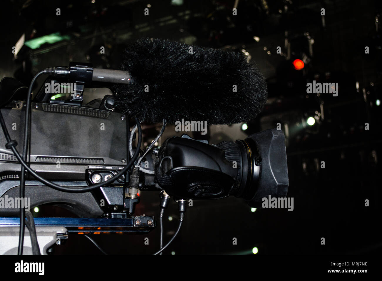 Professional video camera film concert on stage.Big pro 4k video cam