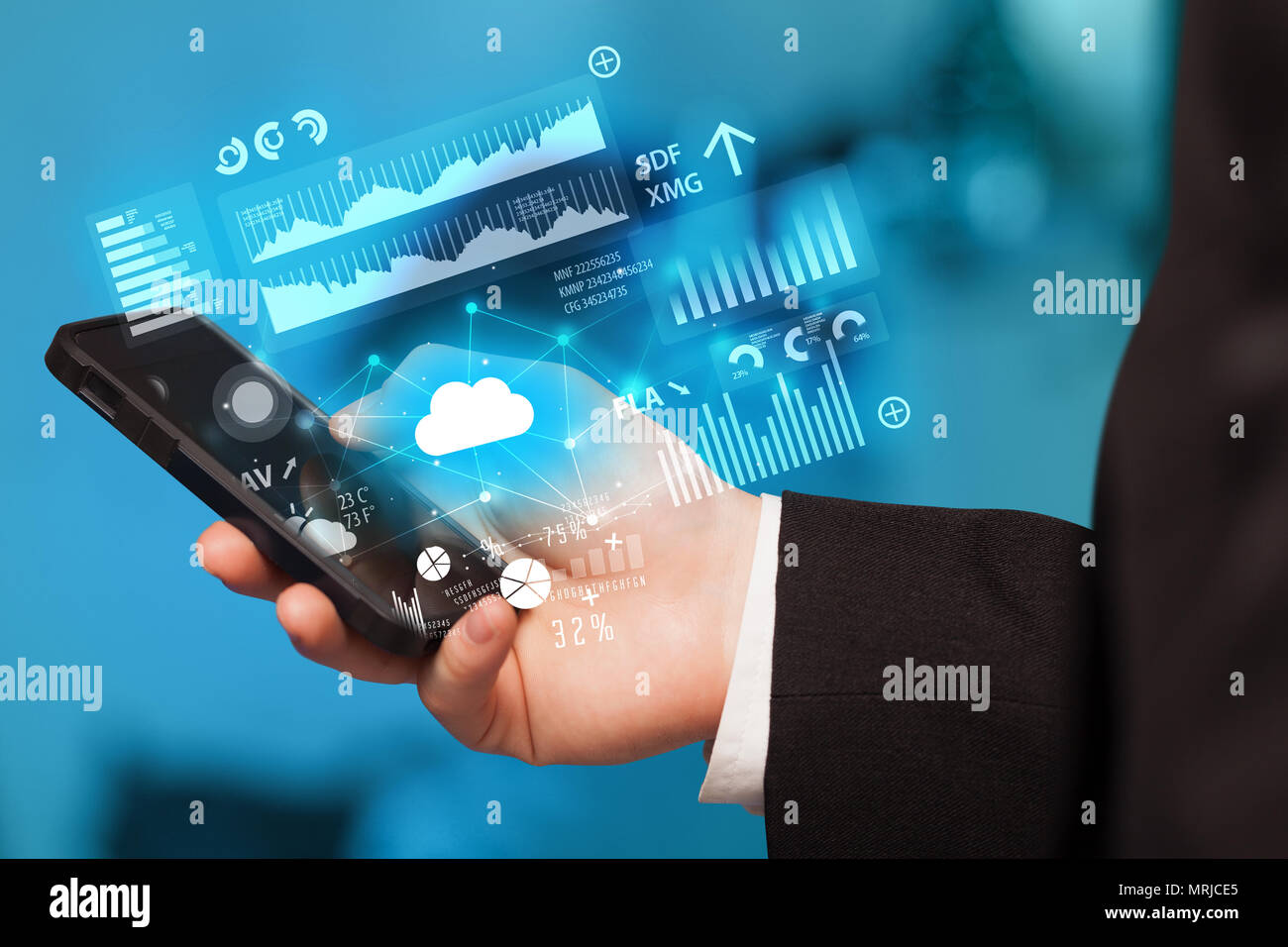 Hand using phone with cloud technology and linked information concept Stock Photo