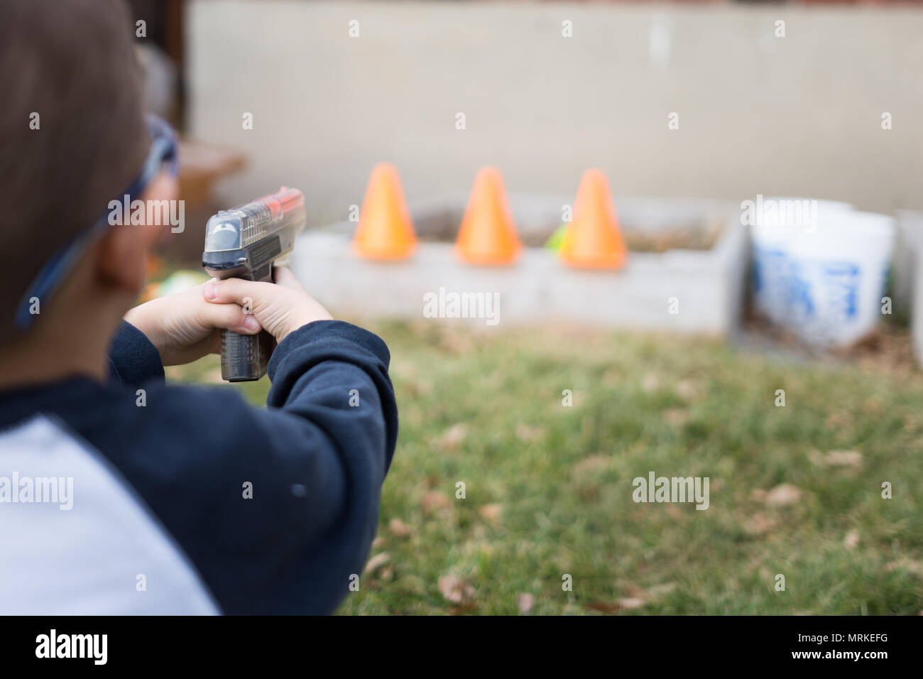 Kid hand holds fake bullets in hand. Concept of ballistics or arms and gun  Stock Photo - Alamy