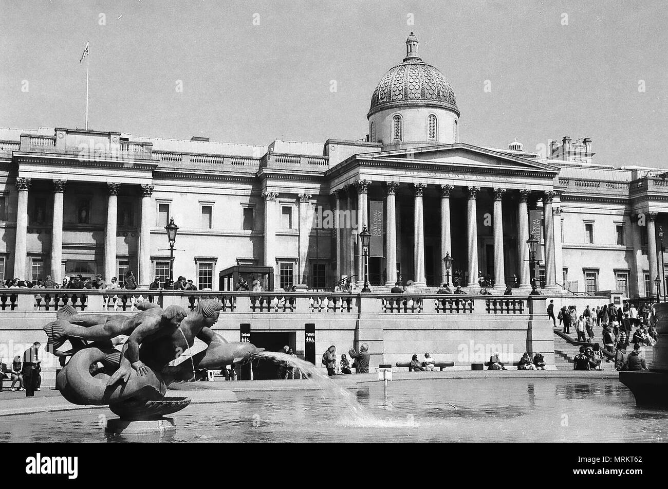 London, UK,  2018.( Image taken on Ilford FP4 film and scanned to convert to digital)  The National Gallery and Trafalgar Square Fountains, Stock Photo
