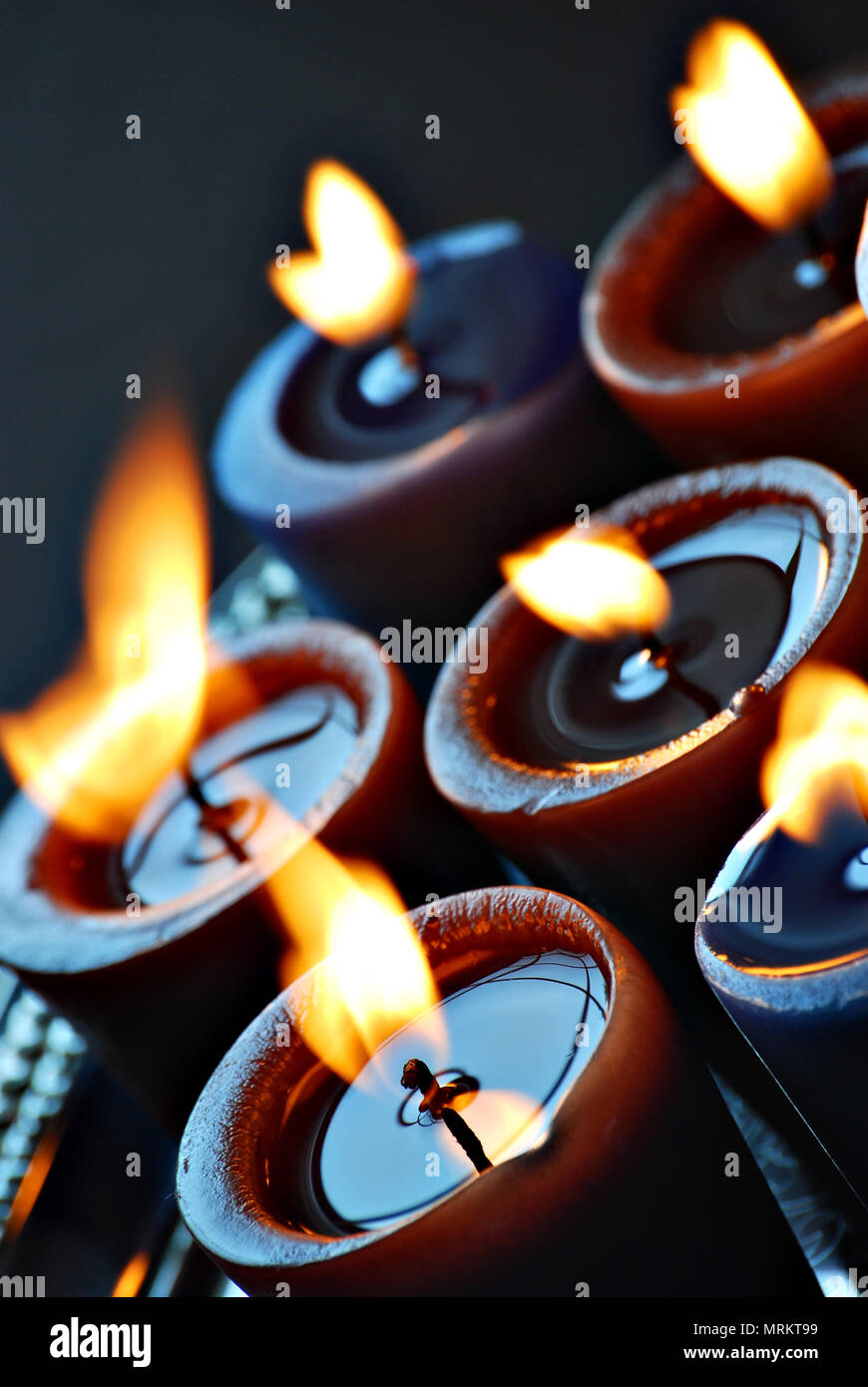 candles burning with blowing flames Stock Photo Alamy