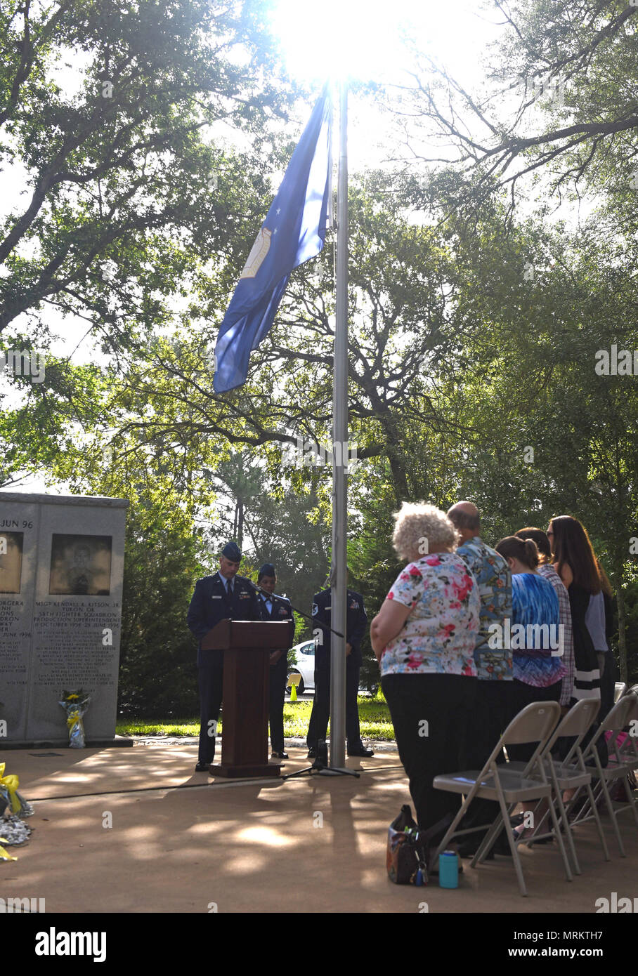 U.S. Air Force Capt. Dustin Creech, 33rd Fighter Wing chaplain, gives the invocation for the Khobar Towers 21st Anniversary Wreath Laying Ceremony June 23, 2017, at Eglin Air Force Base, Florida. On June 25, 1996, a bomb was detonated near the Khobar Towers housing complex in Dhahran, Saudi Arabia. Nineteen Airmen were killed and more than 400 U.S. and international military and civilians were injured in the blast.  Of the 19 killed, 12 were Nomads. Each year the 33 FW holds a ceremony in remembrance of that day. (U.S. Air Force photo by Staff Sgt. Peter Thompson) Stock Photo