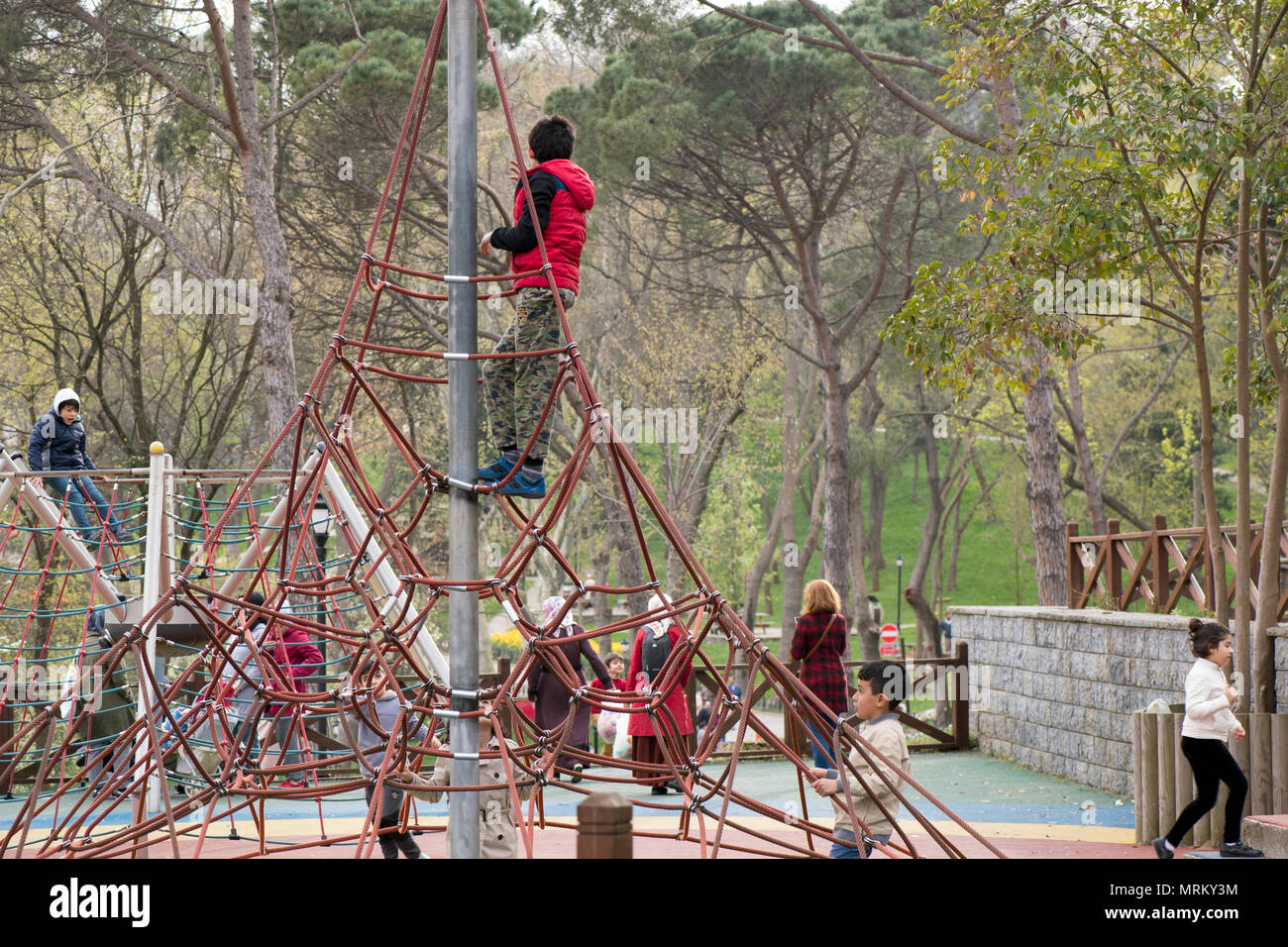 Children playing in the emirgan park at playground,Istanbul Stock Photo