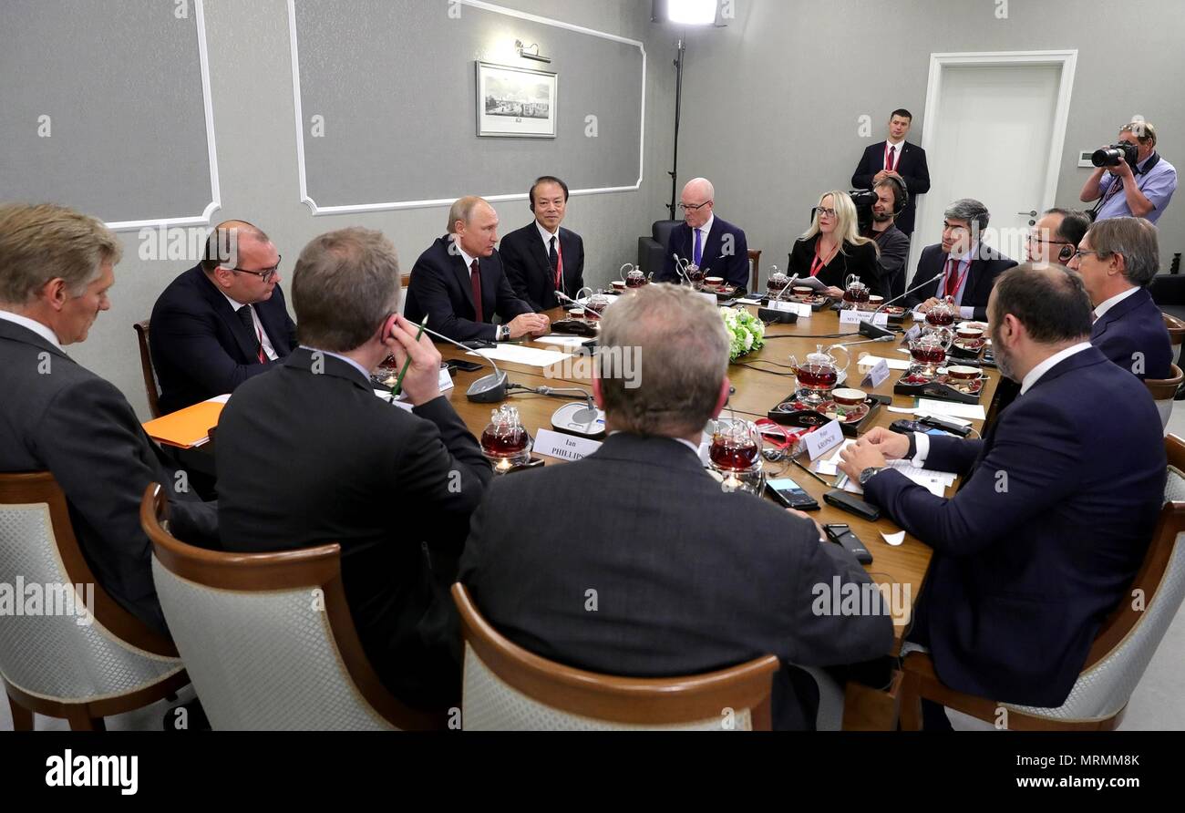 Russian President Vladimir Putin, center, during a meeting with international news agency editors on the sidelines of the 22nd St Petersburg International Economic Forum May 25, 2018 in St. Petersburg, Russia.    (Russian Presidency via Planetpix) Stock Photo