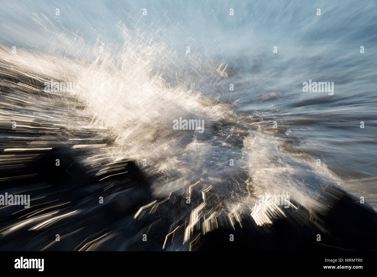 Abstract background zoom in zoom out technic photo of waves on the beach. Stock Photo