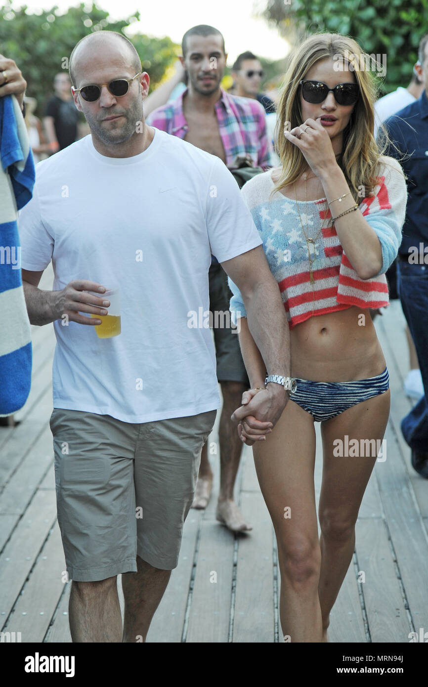 MIAMI BEACH, FL - FILE PHOTO - RED, WHITE AND BLUE PATRIOTIC BIKINI -  Relaxing in the Florida sun, Actor Jason Statham 44 wearing shorts and a  white T-shirt and Victoria Secret