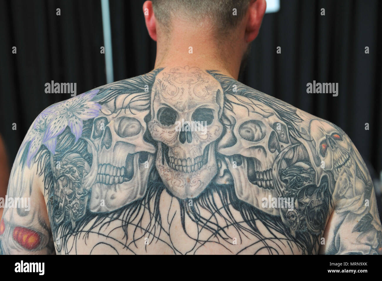 London, UK. 26th May, 2018. A man with a back tattoo at the 5th Great British  Tattoo Show, which is taking place over the weekend in Alexandra Palace,  London, UK. The show