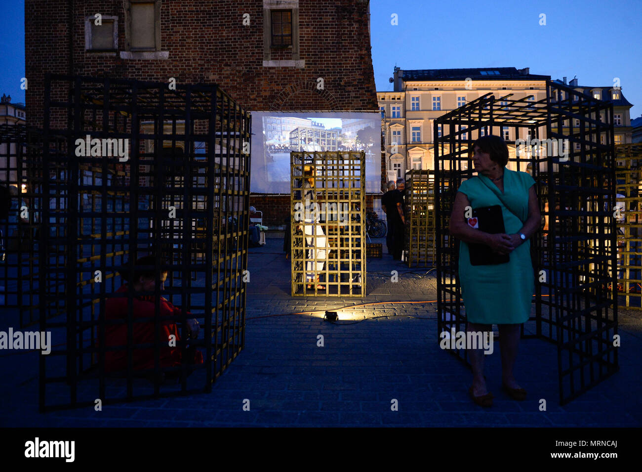 Women seen inside cages during a demonstration. Women take part in a ‘performance’ protest inside several cages in the Main Square to express their solidarity for the Women right during Mother Day in Krakow. Credit: SOPA Images Limited/Alamy Live News Stock Photo