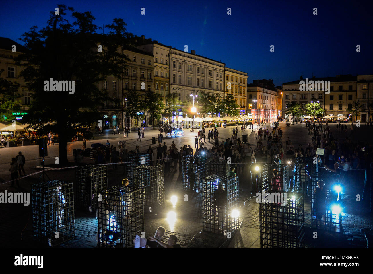 General view of the demonstration. Women take part in a ‘performance’ protest inside several cages in the Main Square to express their solidarity for the Women right during Mother Day in Krakow. Credit: SOPA Images Limited/Alamy Live News Stock Photo