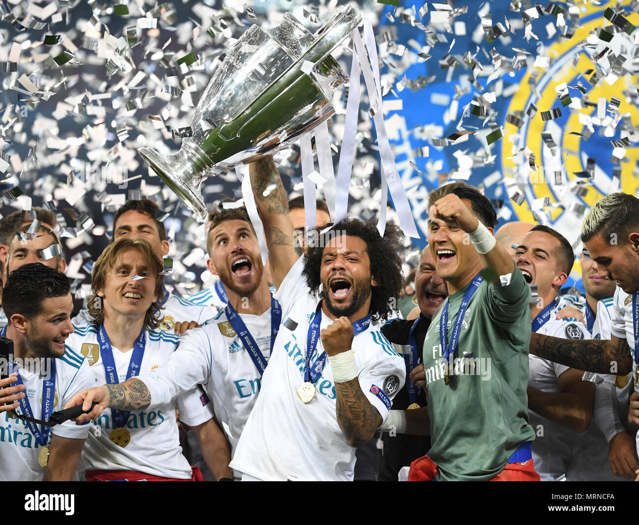 26 May 2018, Ukraine, Kiev: Soccer, Champions League final, Real Madrid vs FC Liverpool at the Olimpiyskiy National Sports Complex. Real's Marcelo (c) holds the Champions League Cup. Photo: Ina Fassbender/dpa Credit: dpa picture alliance/Alamy Live News Stock Photo