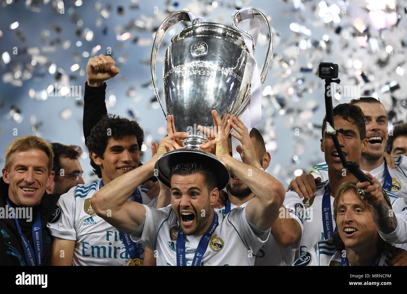26 May 2018, Ukraine, Kiev: Soccer, Champions League final, Real Madrid vs FC Liverpool at the Olimpiyskiy National Sports Complex. Real's Nacho (c) holds the Champions League Cup. Photo: Ina Fassbender/dpa Credit: dpa picture alliance/Alamy Live News Stock Photo