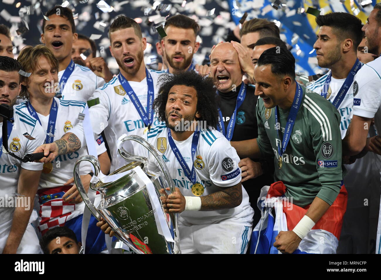 26 May 2018, Ukraine, Kiev: Soccer, Champions League final, Real Madrid vs FC Liverpool at the Olimpiyskiy National Sports Complex. Real's Marcelo (c) holds the Champions League Cup. Photo: Ina Fassbender/dpa Credit: dpa picture alliance/Alamy Live News Stock Photo