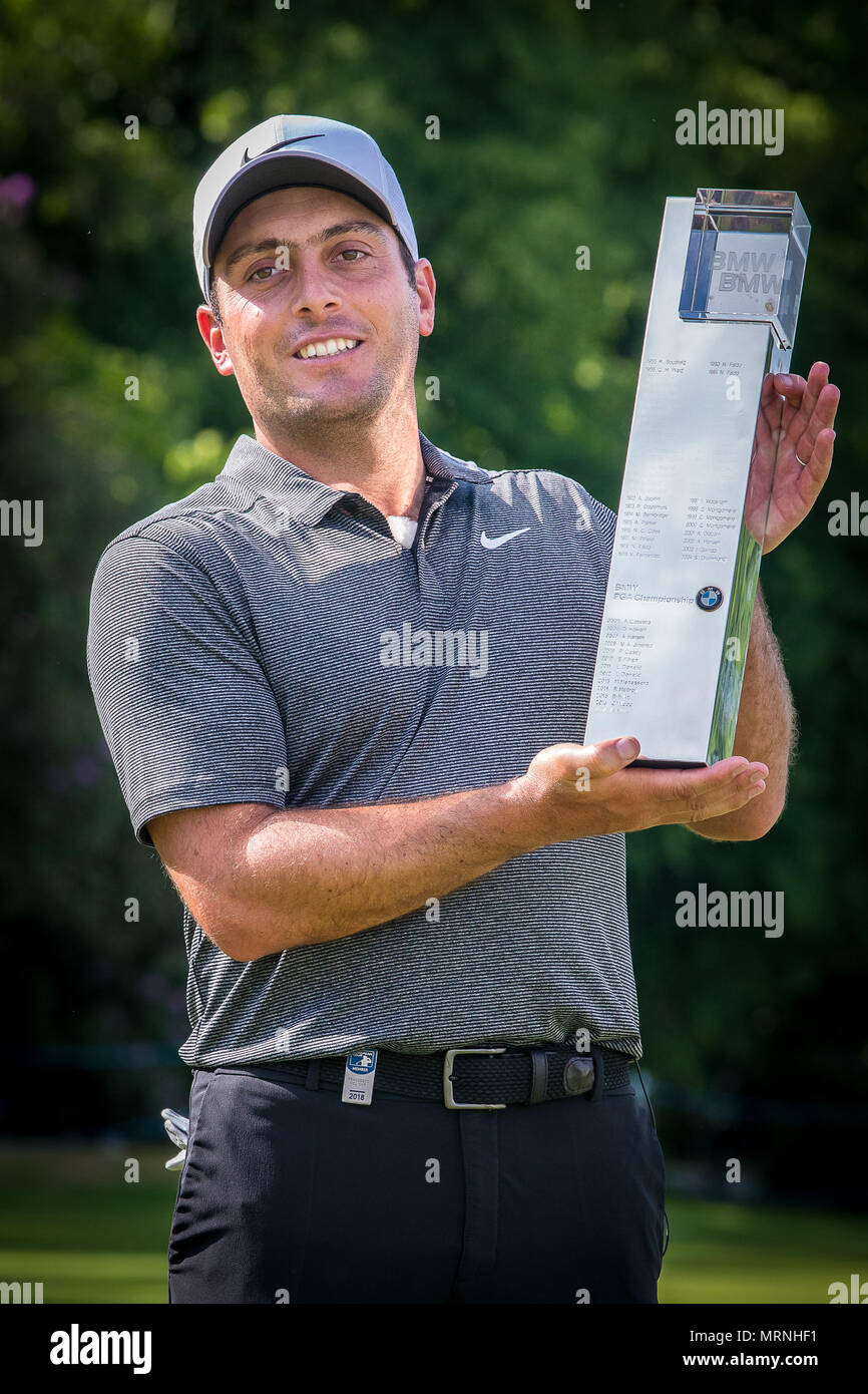 Surrey, UK. 27th May, 2018. To the Victor the spoils Francesco Molinari holds aloft the BMW PGA Championship Trophy after beating Rory Mcilroy into second place at Wentworth this afternoon. This is his 5th European Tour Victory and the first time he has won this event having finished second last year. Credit: David Betteridge/Alamy Live News Stock Photo