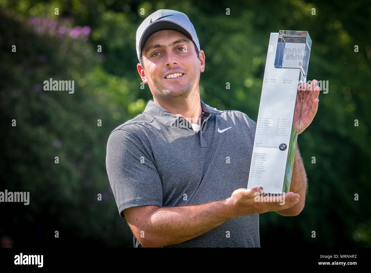 Surrey, UK. 27th May, 2018. To the Victor the spoils Francesco Molinari holds aloft the BMW PGA Championship Trophy after beating Rory Mcilroy into second place at Wentworth this afternoon. This is his 5th European Tour Victory and the first time he has won this event having finished second last year. Credit: David Betteridge/Alamy Live News Stock Photo