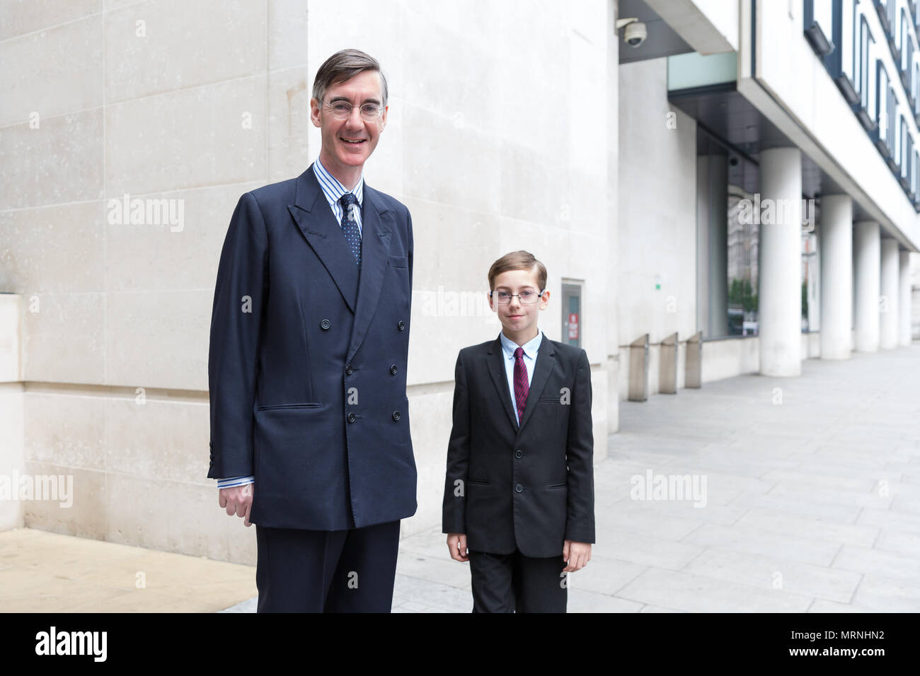 London, UK. 27th May 2018. Jacob Rees-Mogg MP outside the BBC studios after appearing on 'The Andrew Marr Show' with his eldest son, Peter Theodore Alphege, aged 9 years old. Credit: TPNews/Alamy Live News Stock Photo