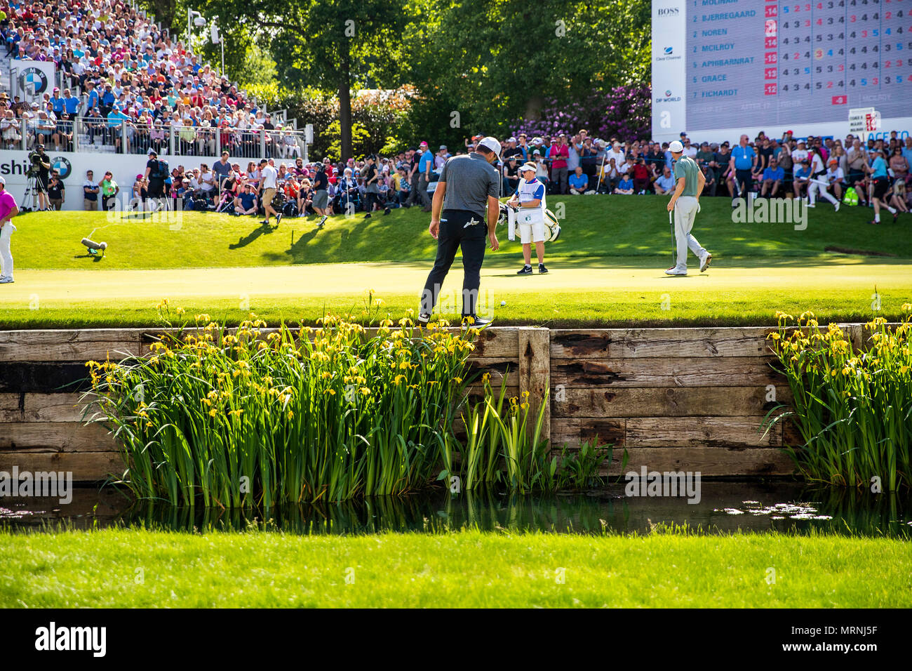 Wentworth Club, Virginia Water, UK. 27th May, 2018. BMW PGA Championship at Wentworth, round 4; Francesco Molinari (ITA) examines his ball that finished perilously close to the hazard on the 18th Credit: Action Plus Sports/Alamy Live News Stock Photo