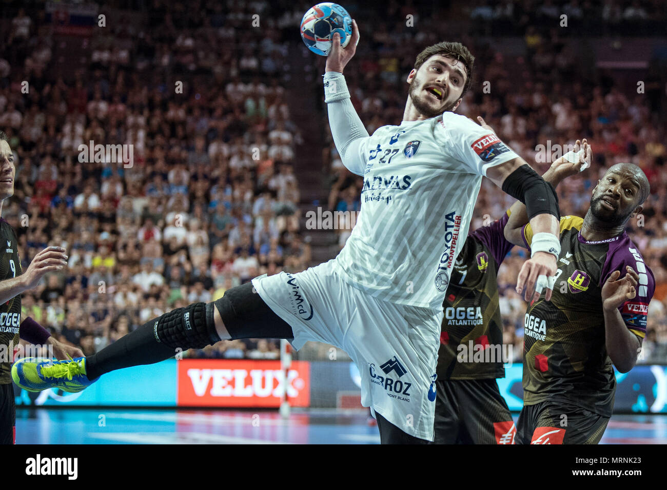 27 May 2018, Germany, Cologne: Handball Champions League final, HBC Nantes vs Montpellier HB at the Lanxess Arena: Rock Feliho (r) of Nantes and Ludovic Fabregas of Montpellier vie for the ball. Photo: Federico Gambarini/dpa Stock Photo