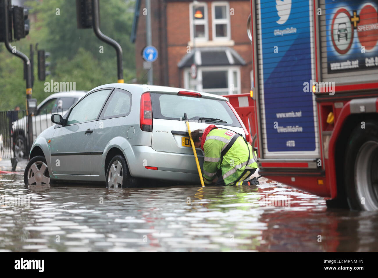 West Midlands Fire service rescuing a car in flood water Stock Photo