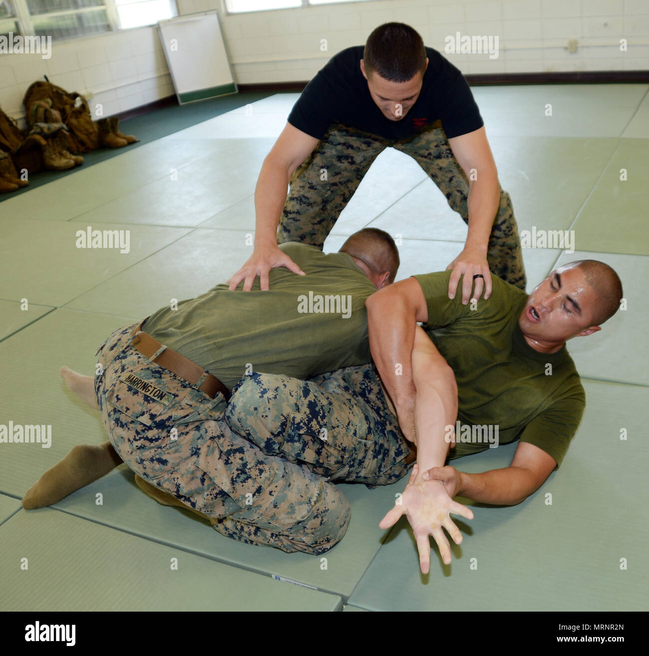 Martial arts instructor students Sgt. Brian Harrington, top, and Sgt
