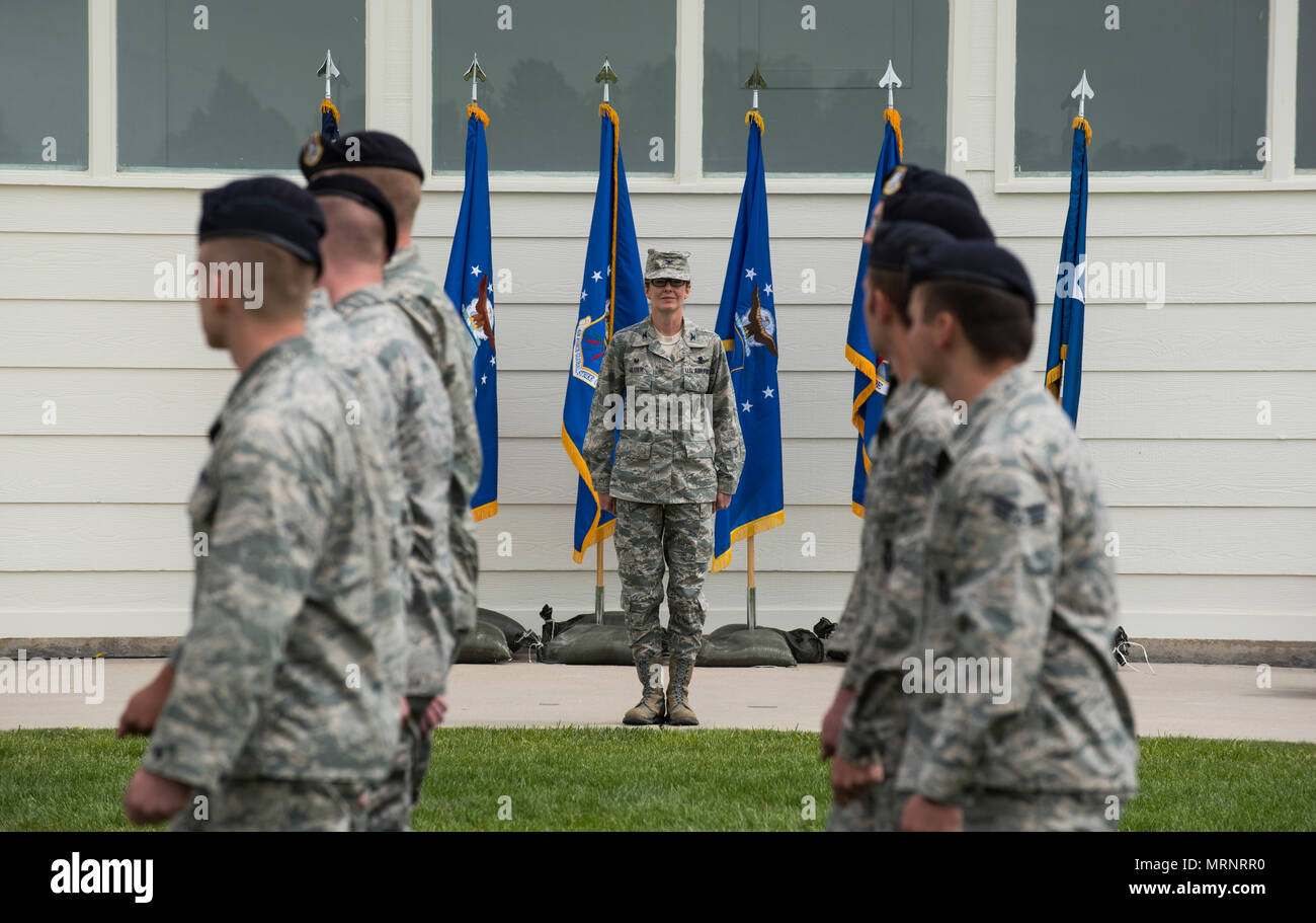 Group formations conduct a pass in review for Col. Stacy Huser, 90th